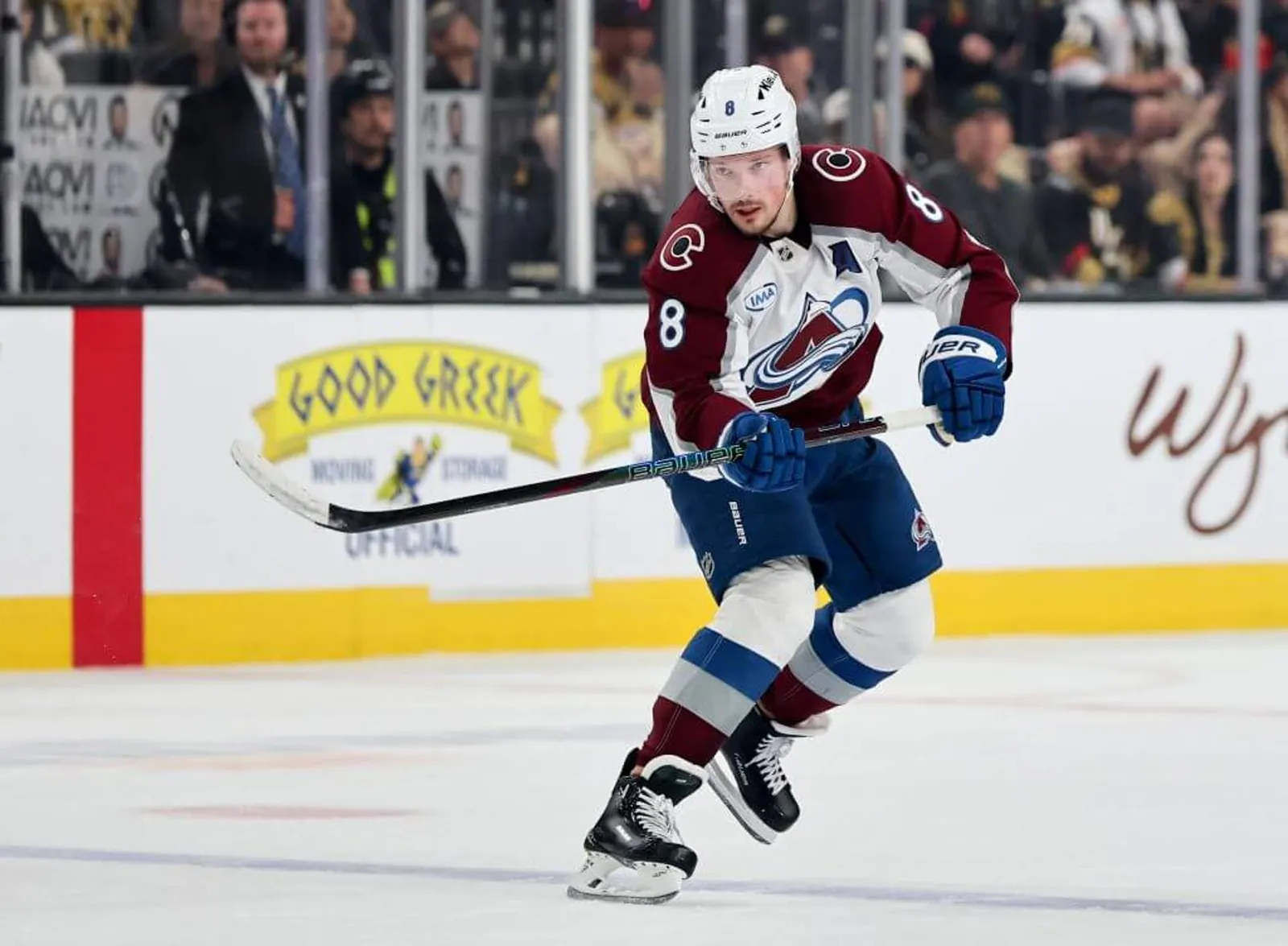 Cale Makar comes to a halt after passing the puck during a Colorado Avalanche game.