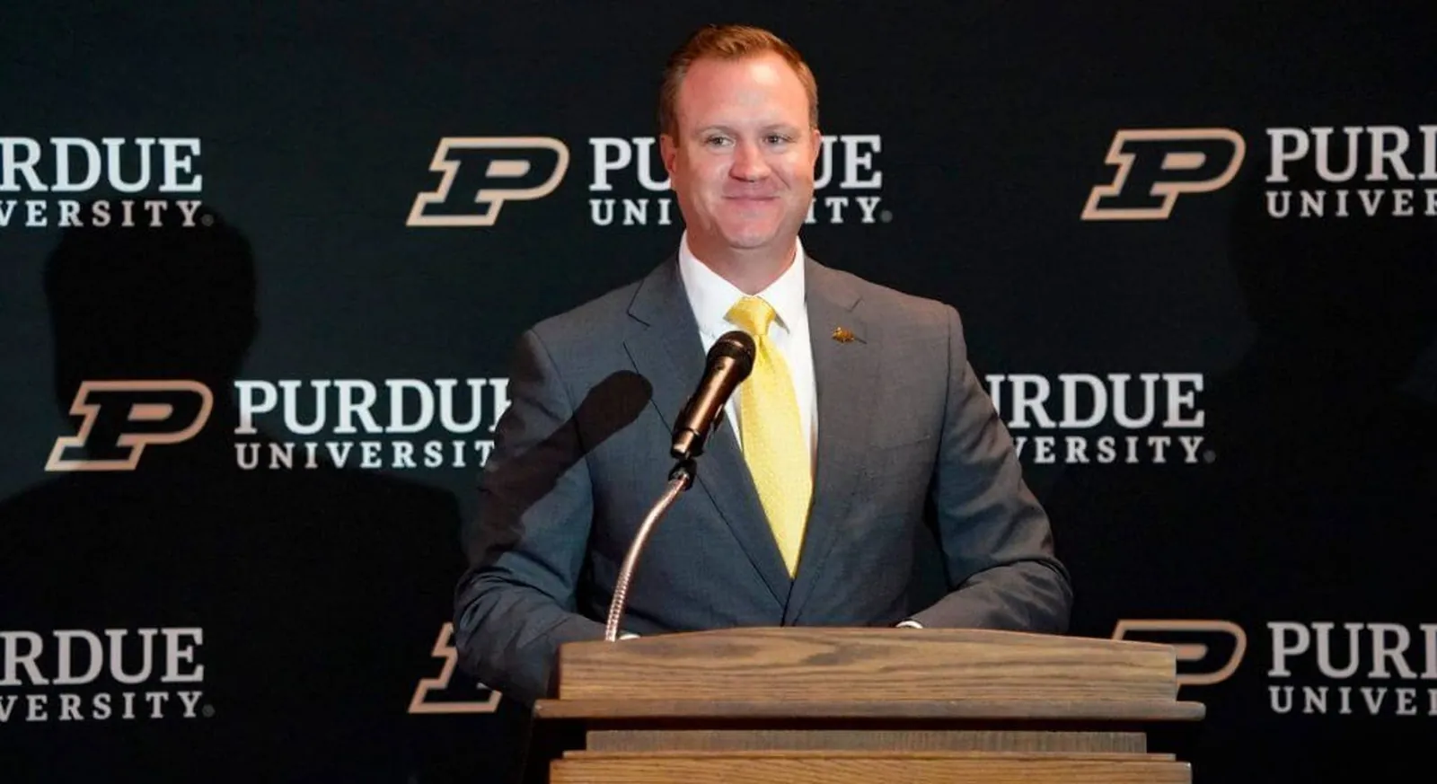 Tommy McClelland stands at the podium